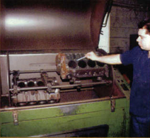 Man-Working-on-engine-Machine